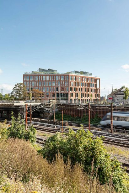 Red brick exterior of KAB headquarters in Copenhagen