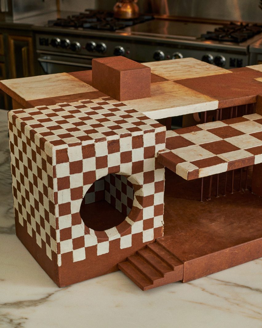 Gingerbread house in modernist style with checkerboard icing and large porthole window