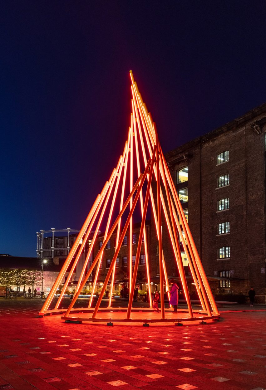 The installation glows red