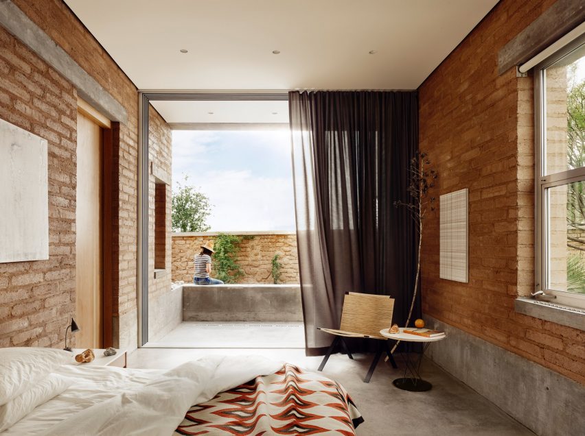 A bedroom with geometric print bedding