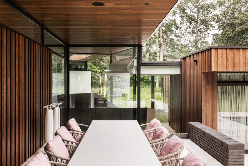 Dining room of Modern House by the River by Maas Architecten