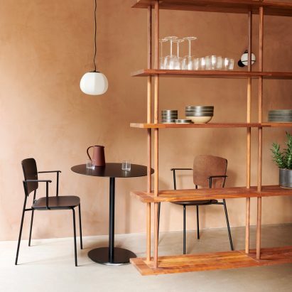 Two Mono chairs with metal bases around a small table