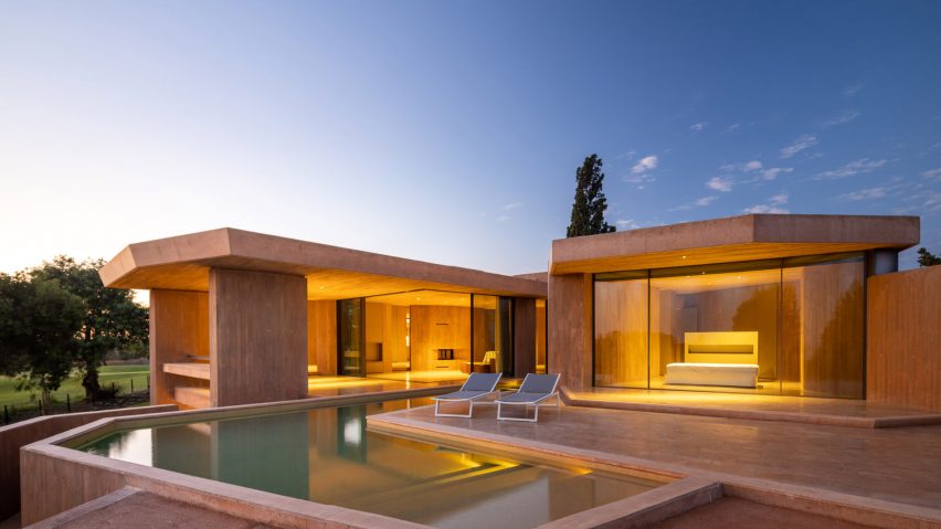 Evening view of the facade of Villa 19 at Palmares Ocean Living & Golf resort by RCR Architectes