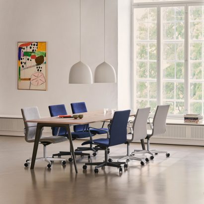 Pluralis table used as a meeting table in a spacious office featured on Dezeen Showroom