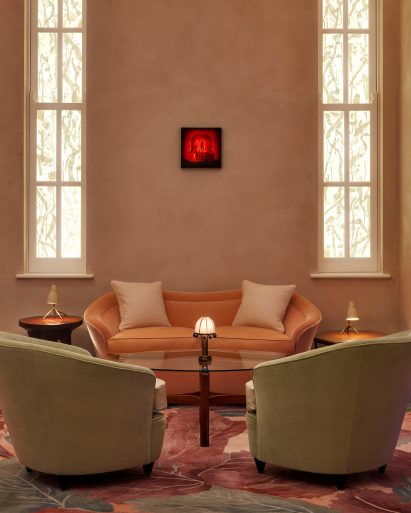 Seating area in The Red Room bar with Louise Bourgeois artwork hanging above