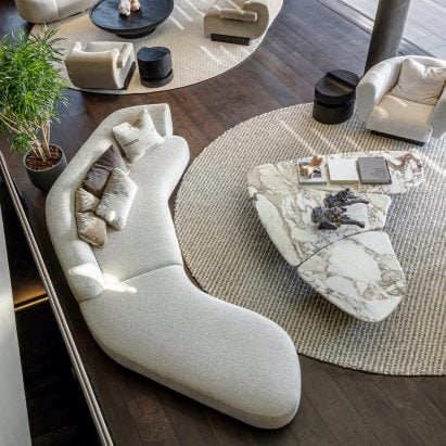 A photograph of the Repose sofa, which was presented on Dezeen Showroom, taken from above in a living room setting