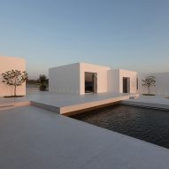 Paros House is comprised of white cubic volumes