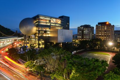 Urban building with spherical and cuboid protrusions