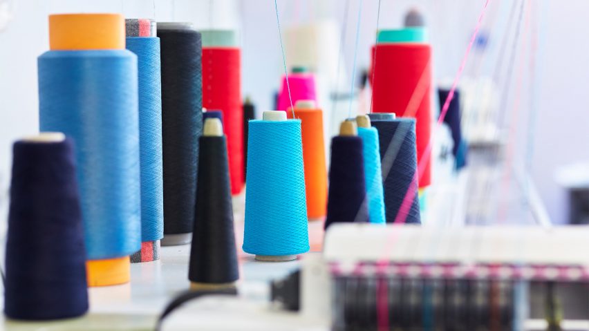 A photograph of a range of colourful sewing threads