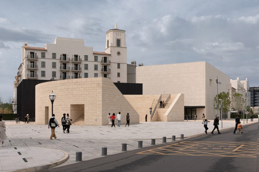 The exterior of a sand coloured theatre