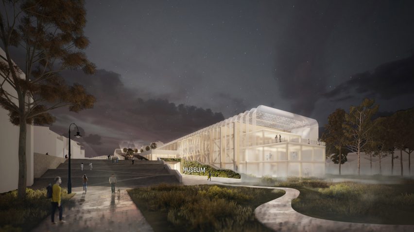 A render of the combined museum and railway station lit up at night