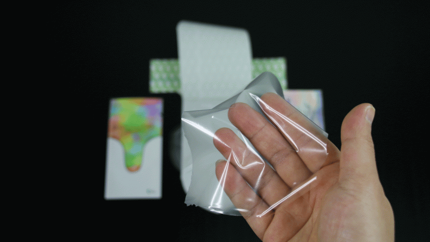 A hand inside the unisex condom
