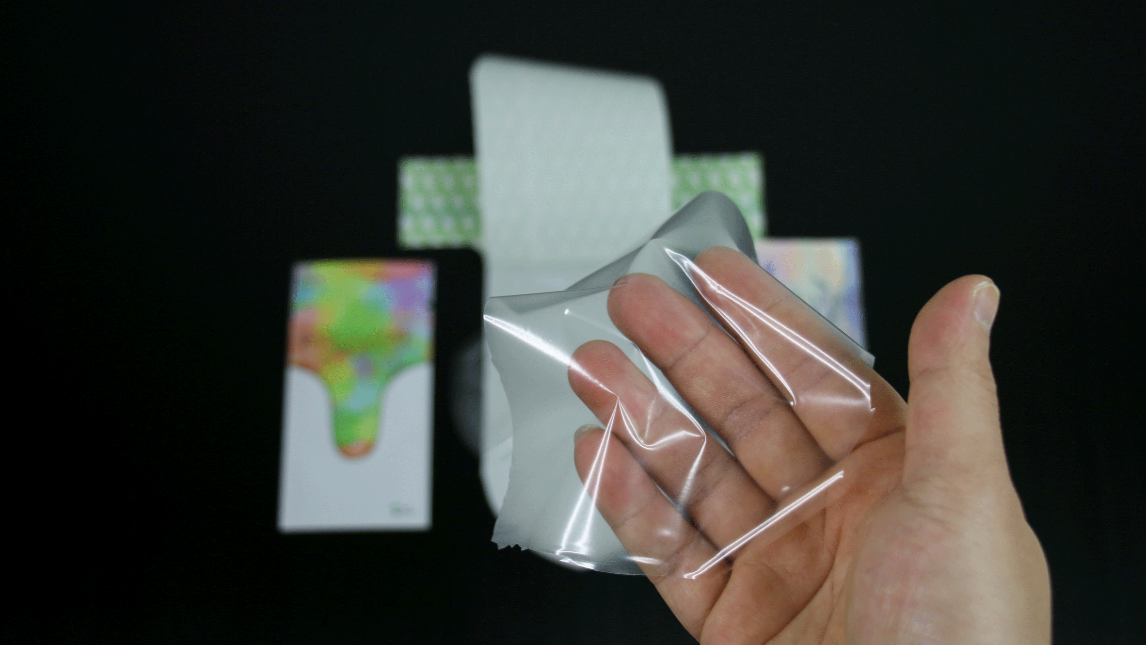 A hand inside the unisex condom