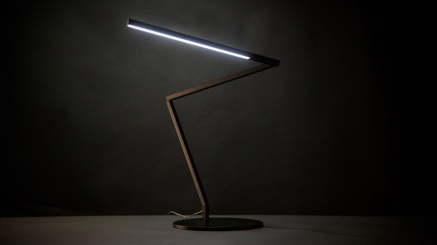 A photograph of a black Z-Bar Gen 4 desk lamp with dark background