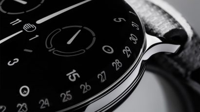 A photograph of the black Ressence watch with honeycomb strap