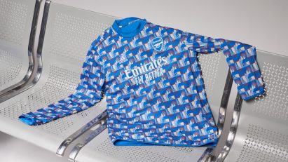 A blue Arsenal football shirt on tube seats
