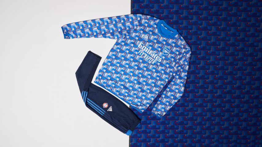 A blue long sleeved shirt and footba;l trousers