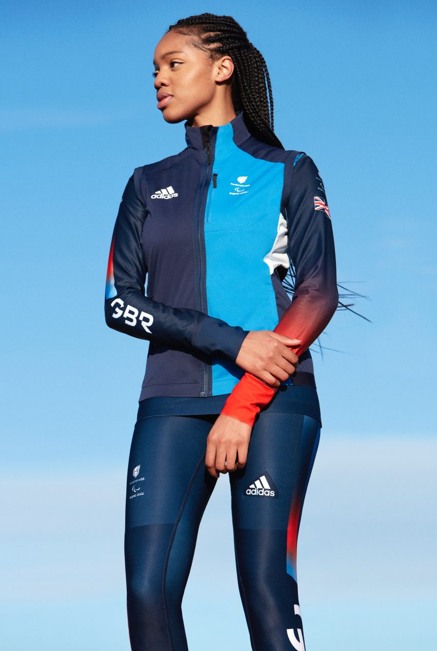 A woman wearing a jacket and leggings by Adidas