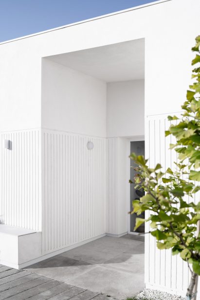 White exterior of Casa Banlusa