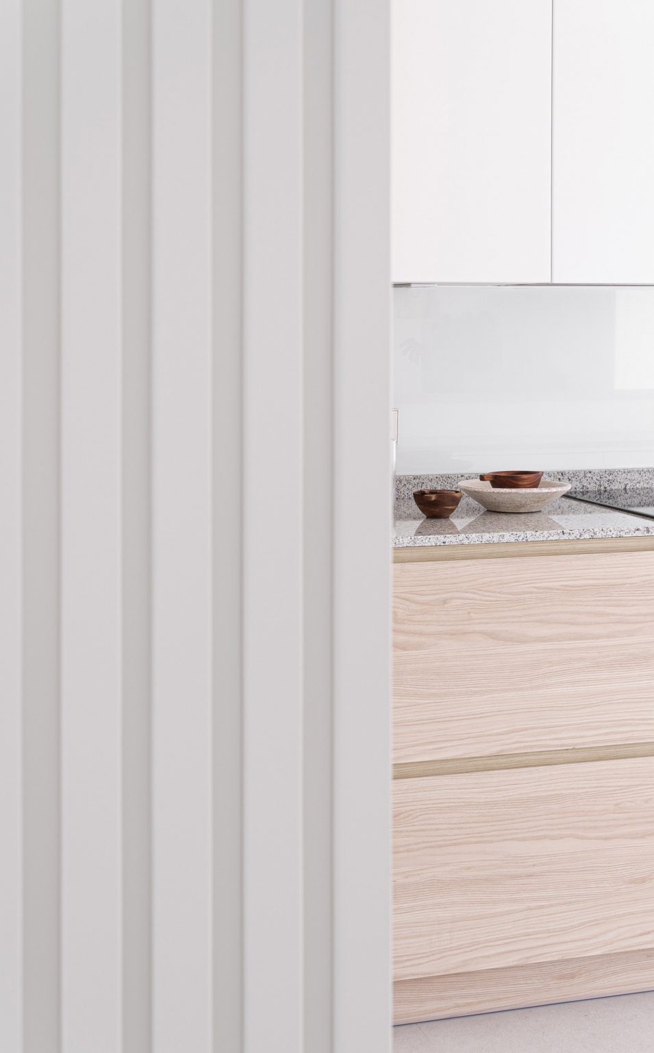 White kitchen with wooden cabinets