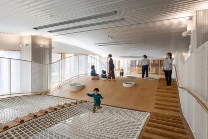 Child playing on net floor