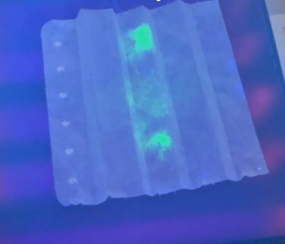 Fabric with glowing coronavirus particles