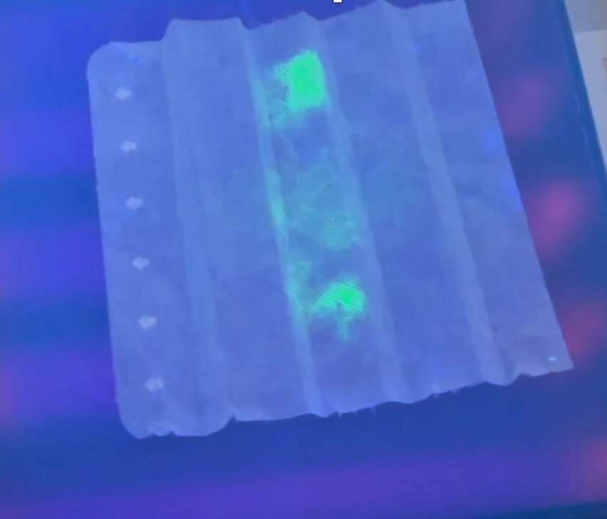 Fabric with glowing coronavirus particles
