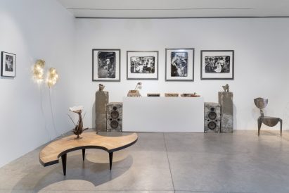 A table and other furnishings inside the exhibition Accidents Will Happen