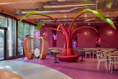 A pink tree in the centre of a kids restaurant