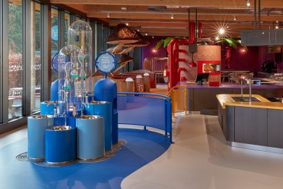 A blue sanitising station inside Family Kitchen