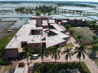 Aerial view of Friendship hospital bisected by zigzagging canal