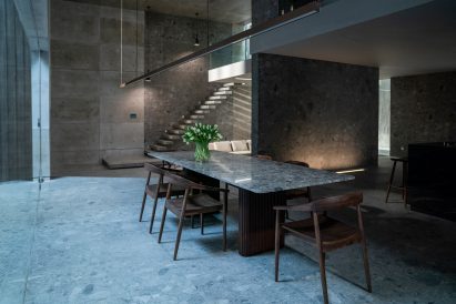A marble table with dining chairs