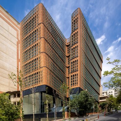 The Hitra Office and Commercial building has a glass and brick facade