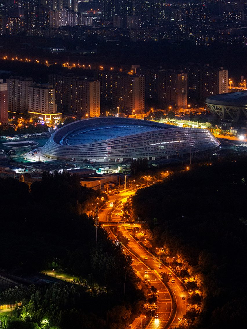 Nighttime aerial view of Ice Ribbon by Populous for Beijing 2022 Winter Olympics