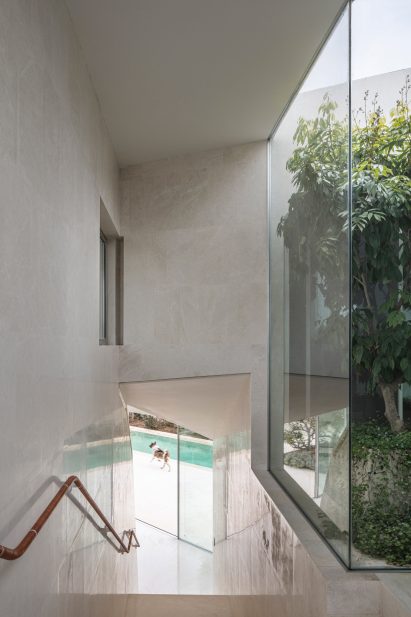 Staircase and trees in IS House by Paritzki & Liani Architects