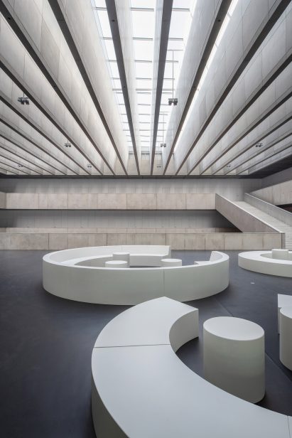 Cantilevered galleries and walkways fill the main space