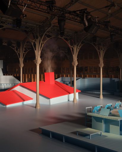 A sunken house with a red roof forms the set at the Louis Vuitton Autumn Winter 2022 show