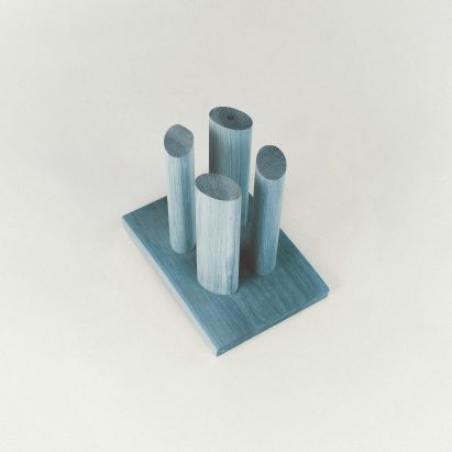 Upside down Rudimentary stool by Mac Collins in light blue colour