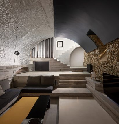 The living room has a vaulted ceiling