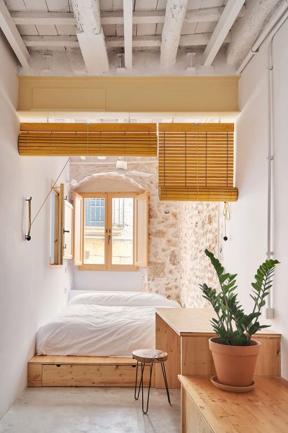 Bedroom with exposed stone walls