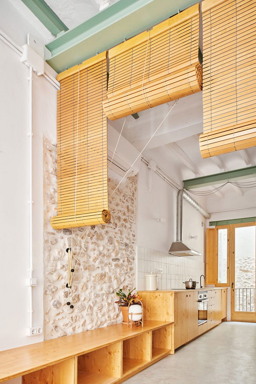 Living room with exposed stone walls