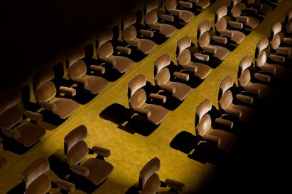 Rows of olive green cinema seats