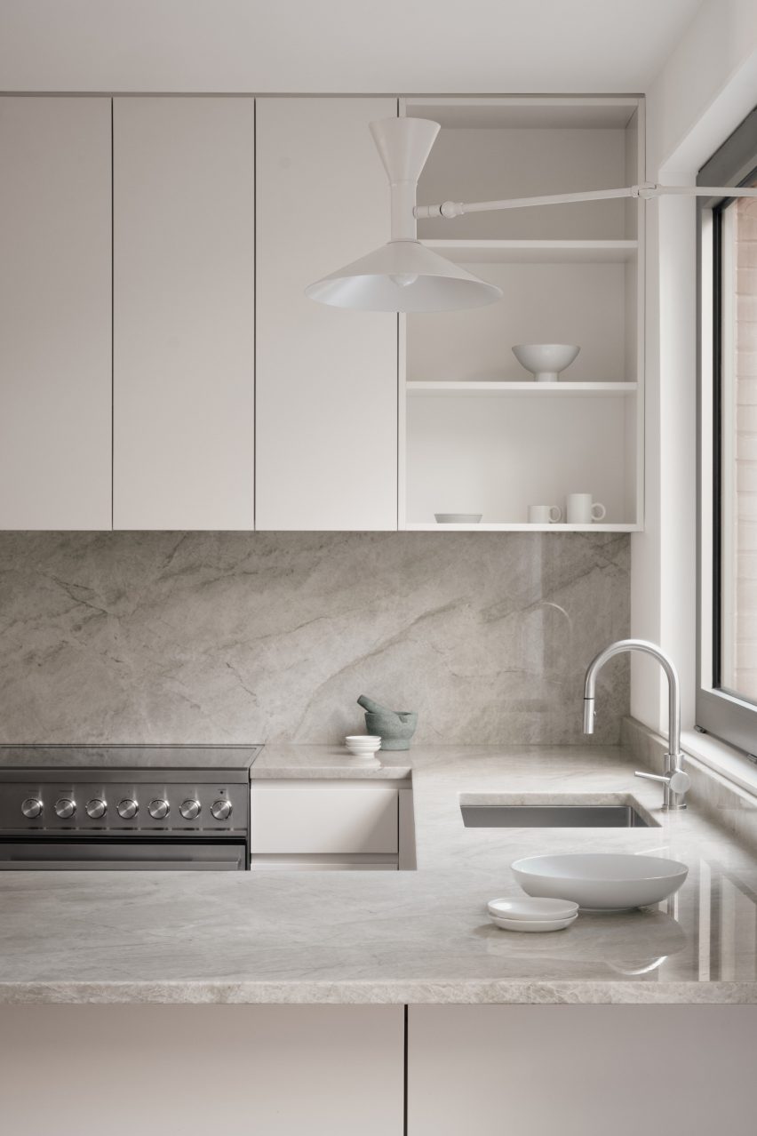 Quartzite kitchen with white cupboards