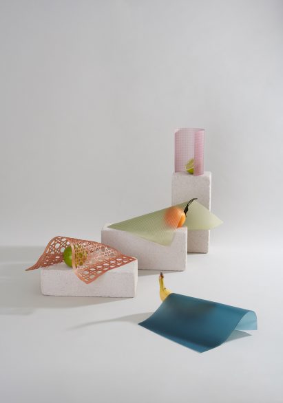 Oranges and bananas next to sheets of vegan leather