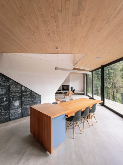 A dining room with a pine table