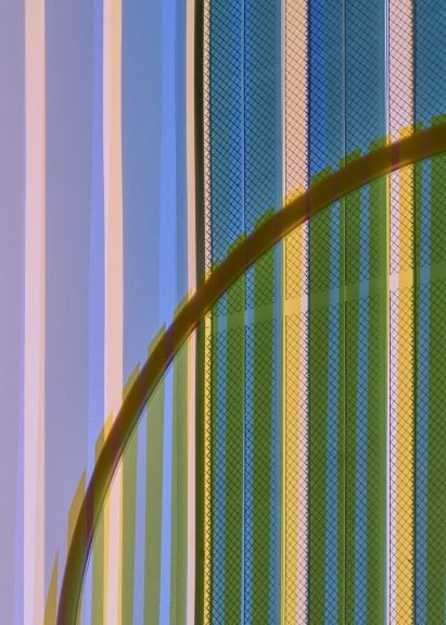 Close-up of organic solar cells in blue, yellow and pink in Ra tapestry by Marjan van Aubel