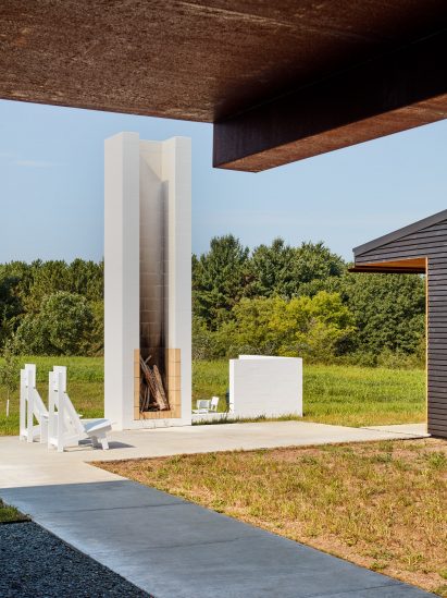 An overhanging roof provides shade at the home