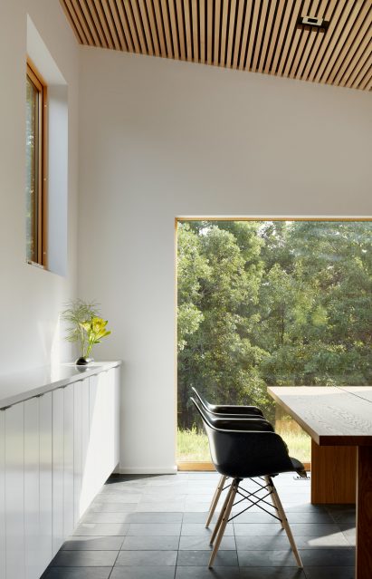 Full-height windows allow light to enter the space