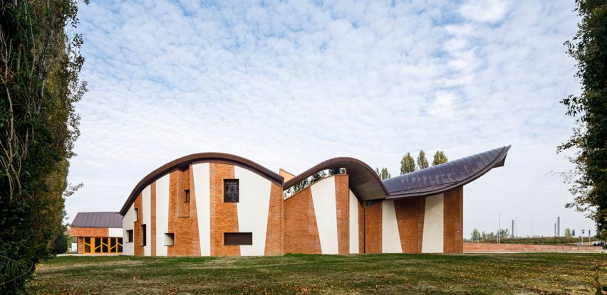 White plaster and brick facade of San Giacomo Apostolo church