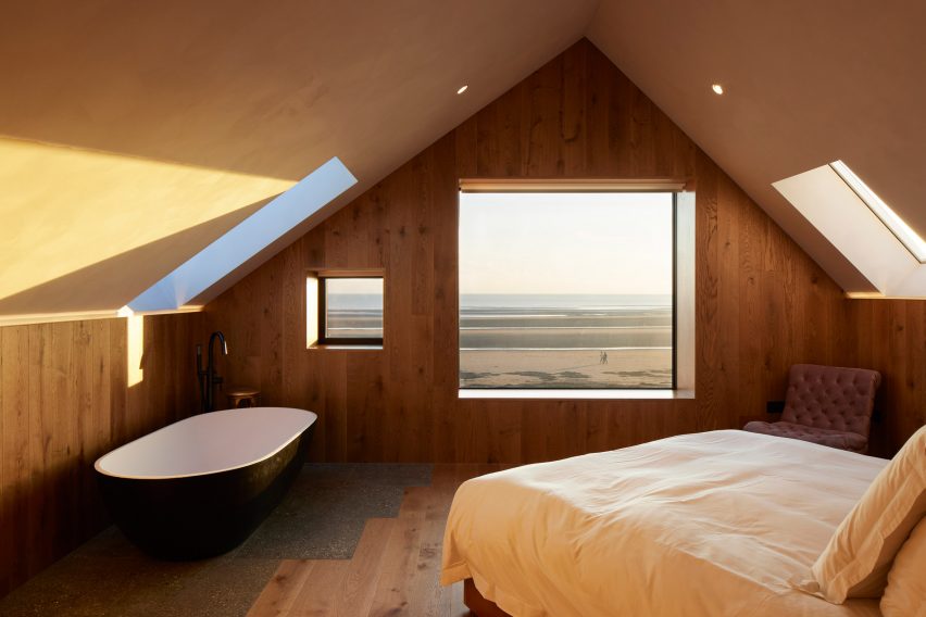 Bedroom with wood-clad walls